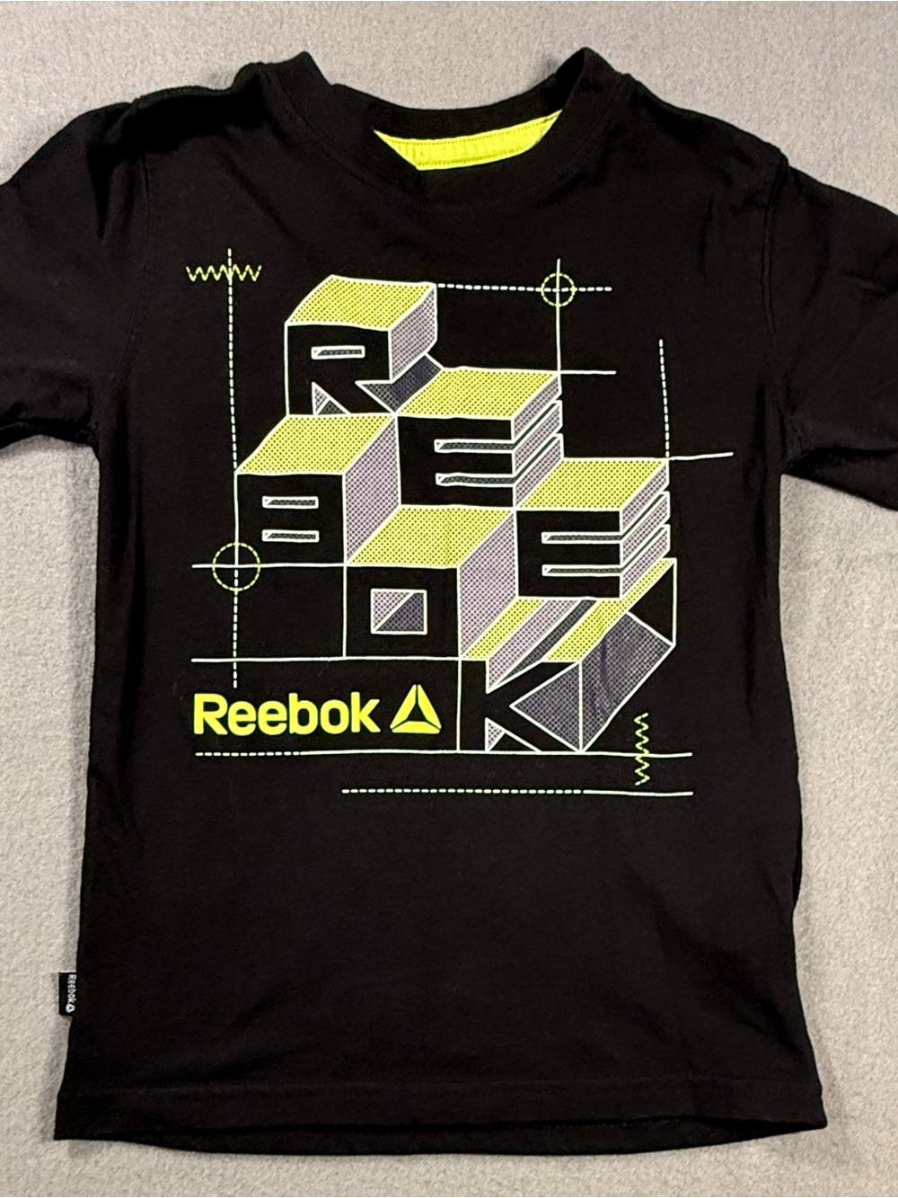Reebok Black Tee with Neon Yellow Geometric Graphic